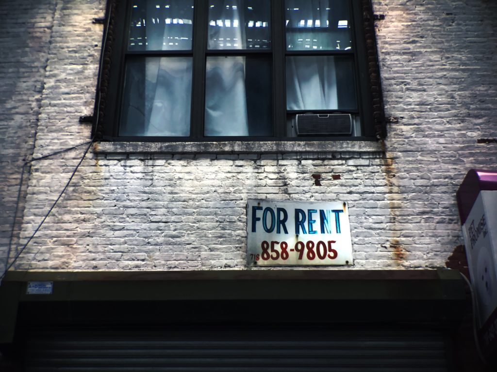 for rent sign outside a window