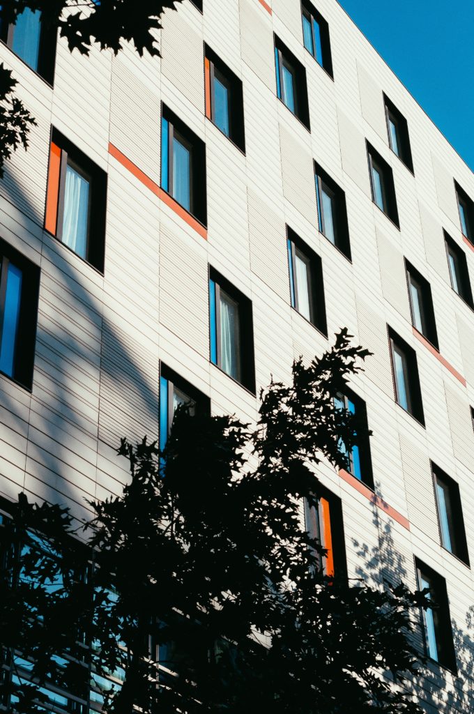 white building with orange and blue windows
