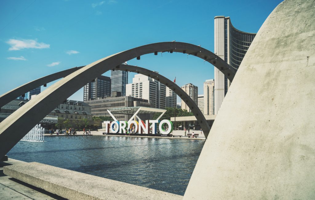 view of a big Toronto sign near a river