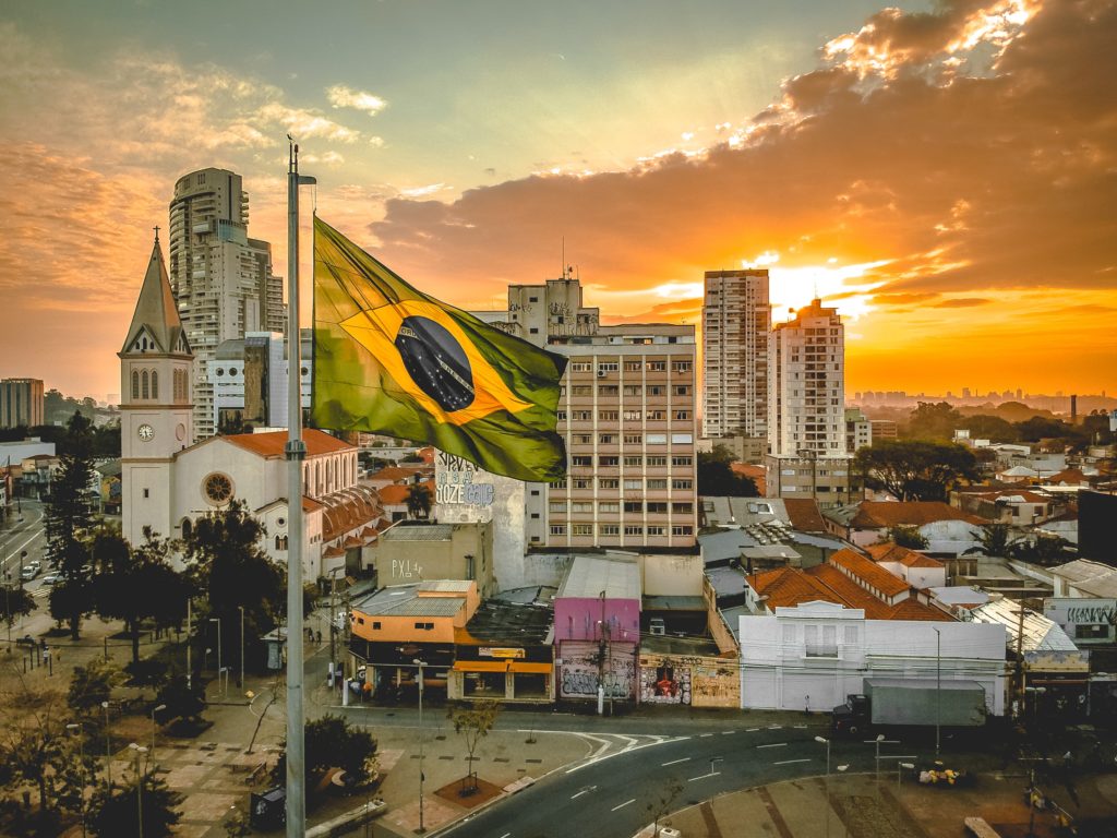 buildings at the back of the Flag of Brazil