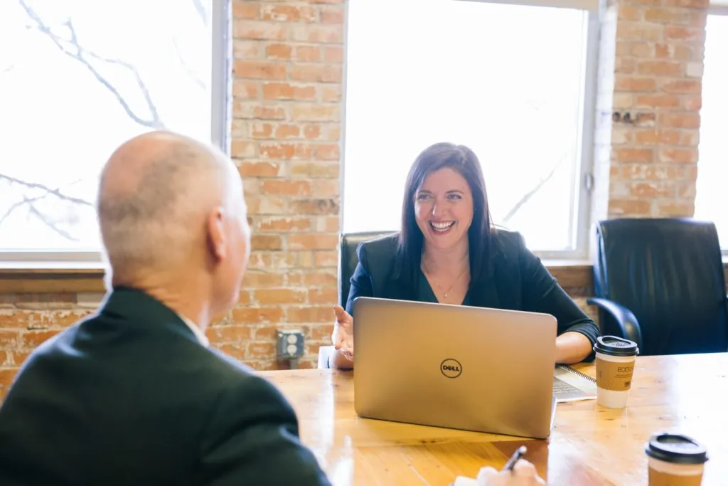 man and woman in a meeting