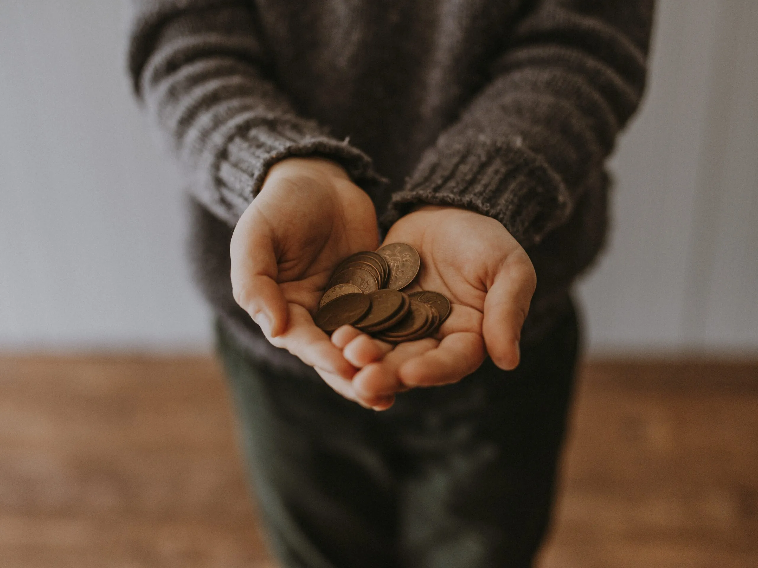 coins in a person's palm
