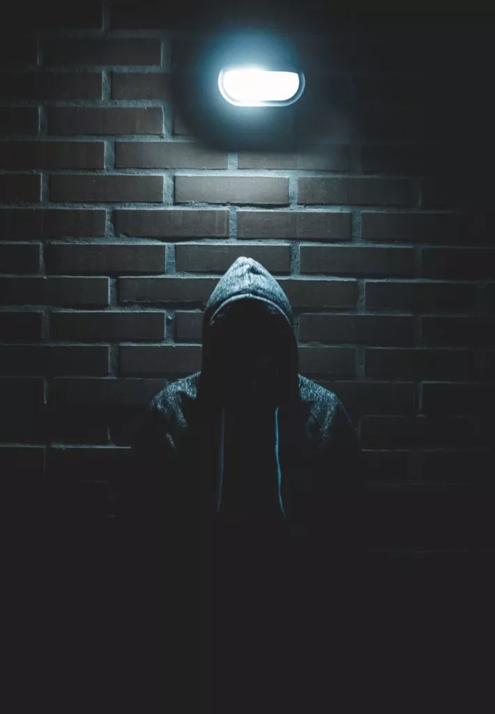 man in a dark alley