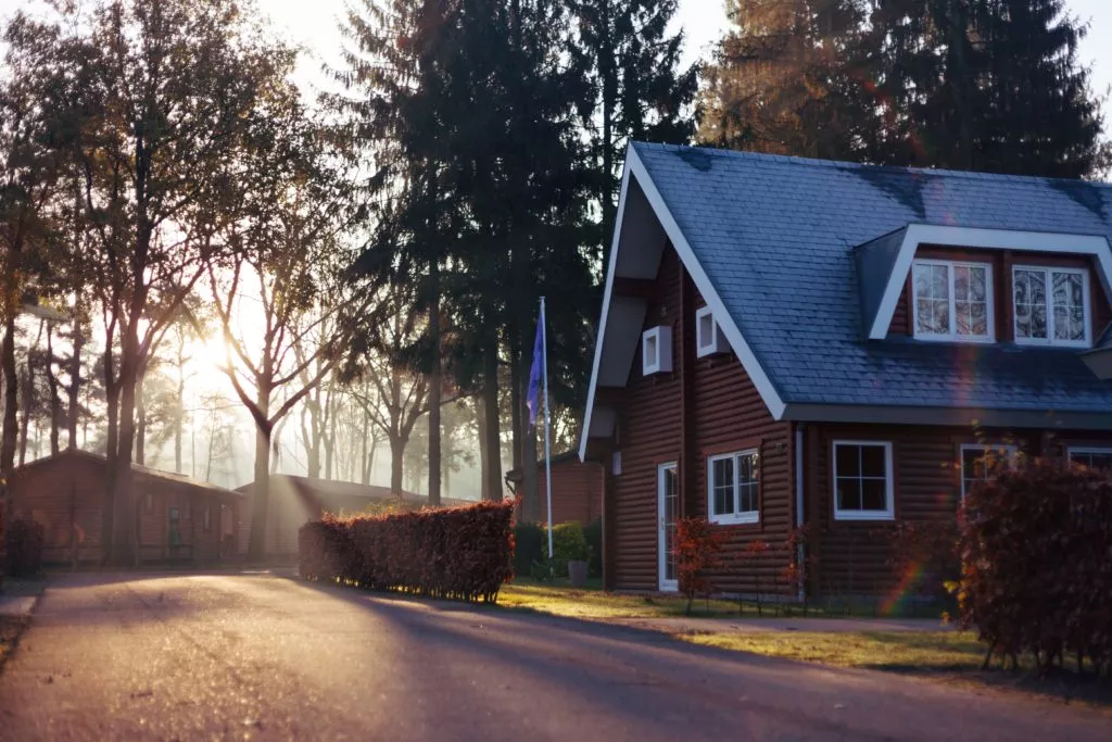 wooden house with blue roof