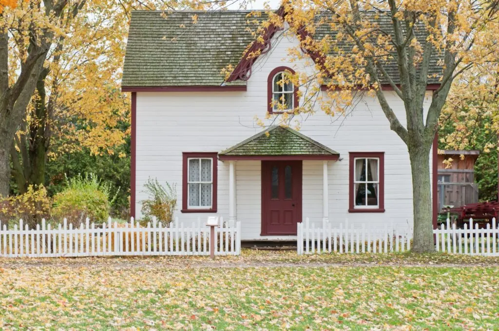 small white house in a rural area